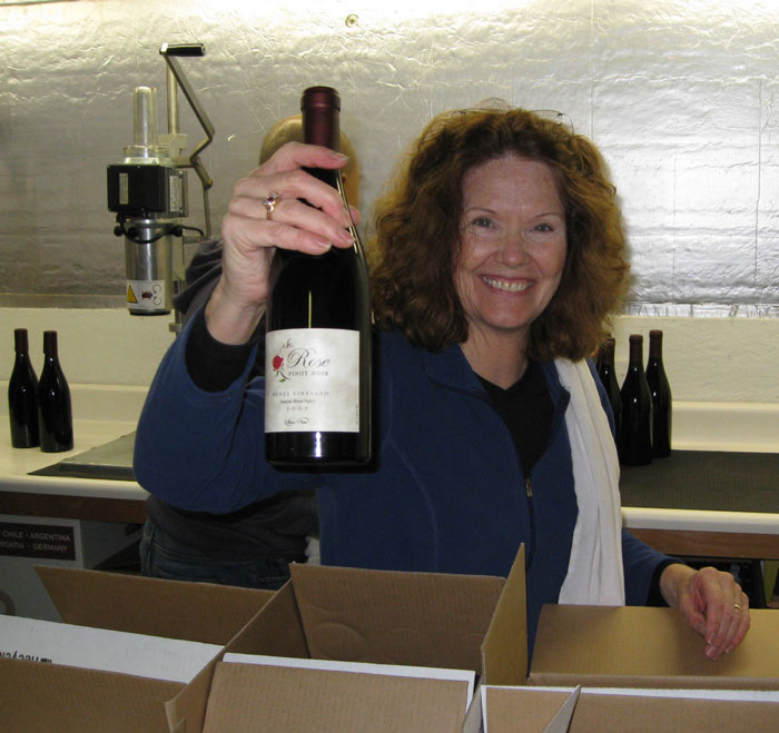 Fred checking pressed wine